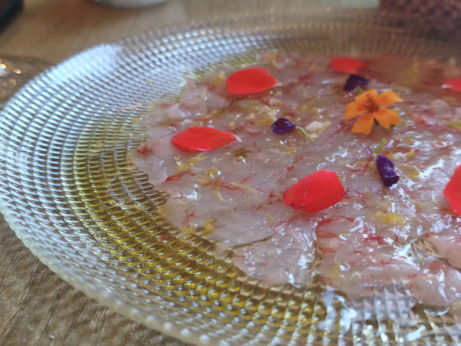 Red prawn carpaccio with flowers